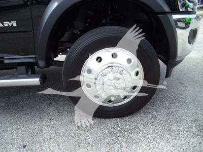 Ram 4500 front wheel with chrome hubcap and wheel well view, part of truck undercarriage visible.