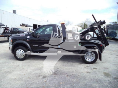 2024 Ram 4500 SLT truck with a winch, black body, side profile view showing front bumper, dual rear tires, and mounted hydraulic winch/loader on the bed.