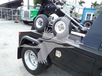Ram 4500 SLT truck bed with winch assembly and spare wheels visible