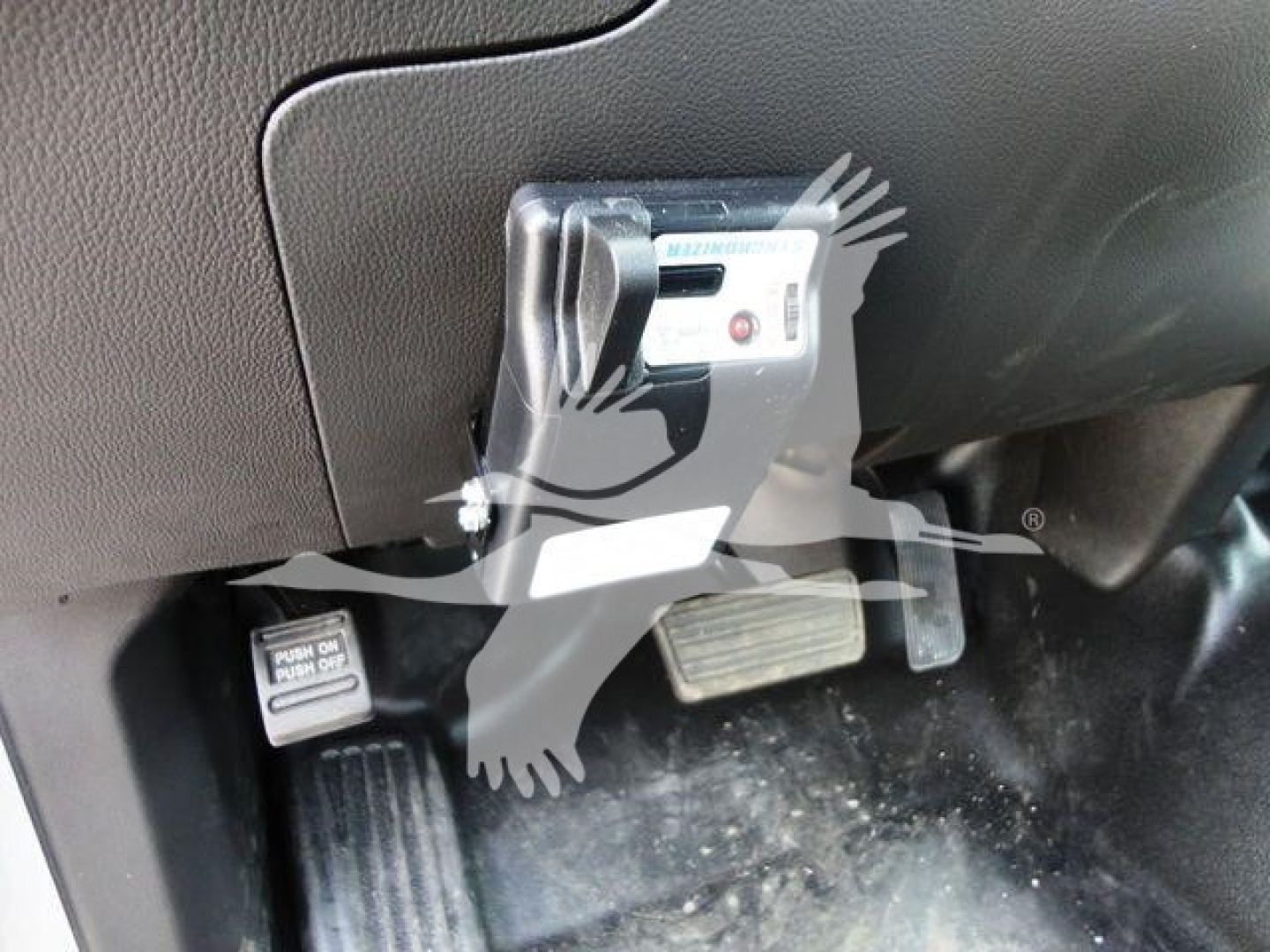 Chevrolet Silverado 6500HD cab area showing push button start/ignition module and pedals with floorboard