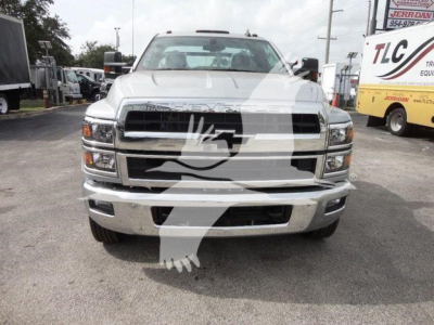Front view of a white 2023 Chevrolet Silverado 6500HD truck in a dealership lot with a large watermark overlay across the image.