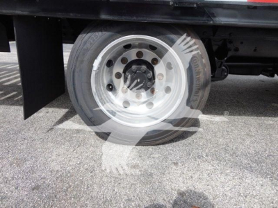Chevrolet Silverado 6500HD wheel and front dual rear tires showing wheel hub and flatbed base.
