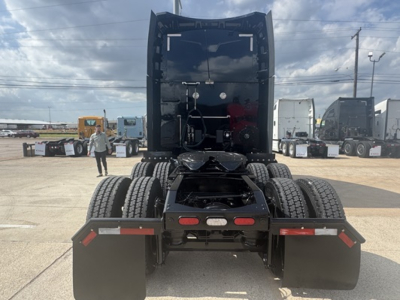 Peterbilt 579 tractor rear view showing fifth wheel, dual rear axles, and mud flaps. VIN and stock not visible on image.