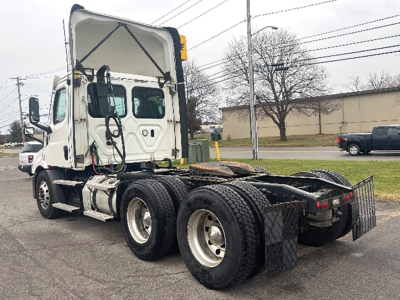 Truck chassis and cab 2021 Freightliner Cascadia126 in service showing rear chassis and dual rear axles.