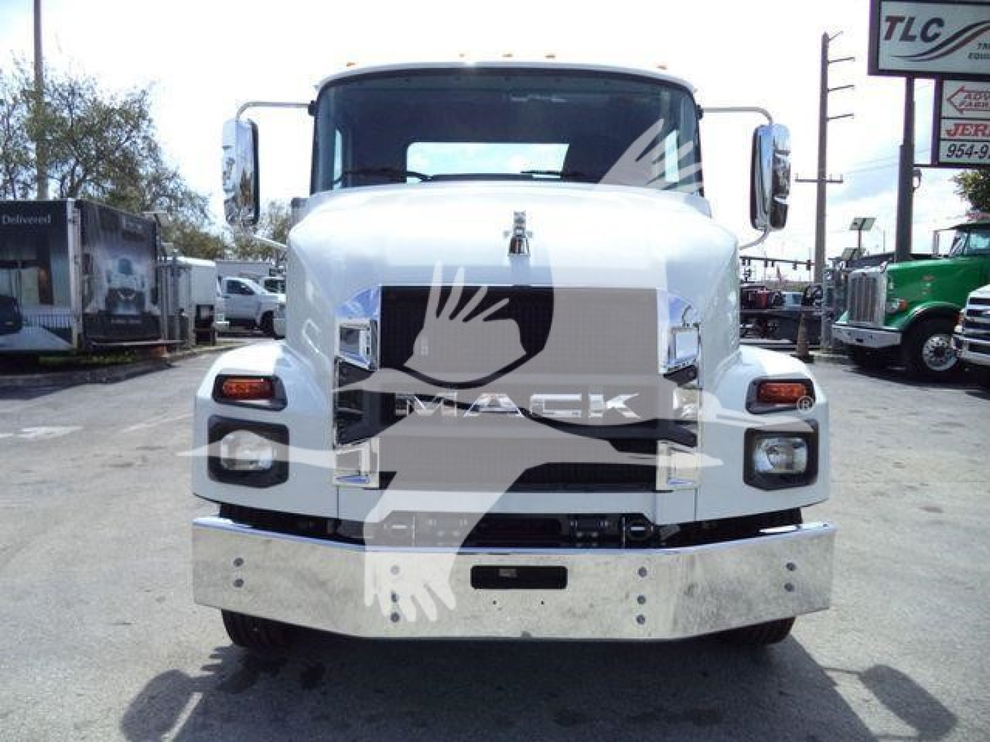 Front view of a white 2027 Mack MD6 truck with chrome bumper and grille, large rectangular headlamps, and side mirrors. Watermark from seller overlaying center.