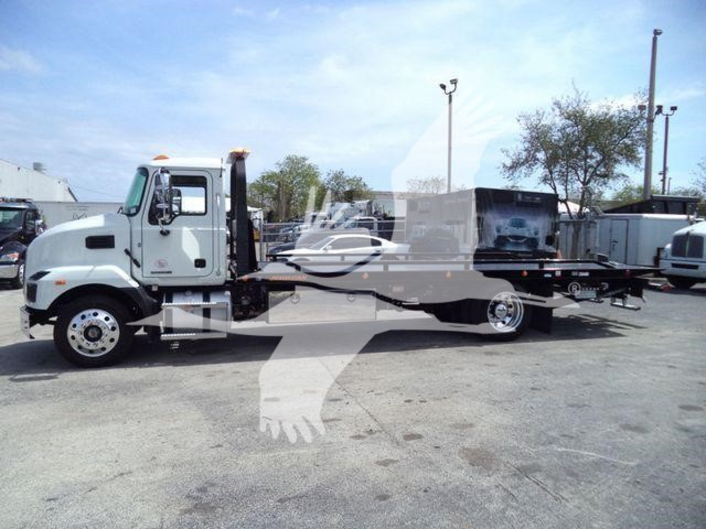 MD6 rollback truck from side view with text elements visible: Mack chassis and rollback bed, stock number J13303, category Rollback, type Trucks, condition New.