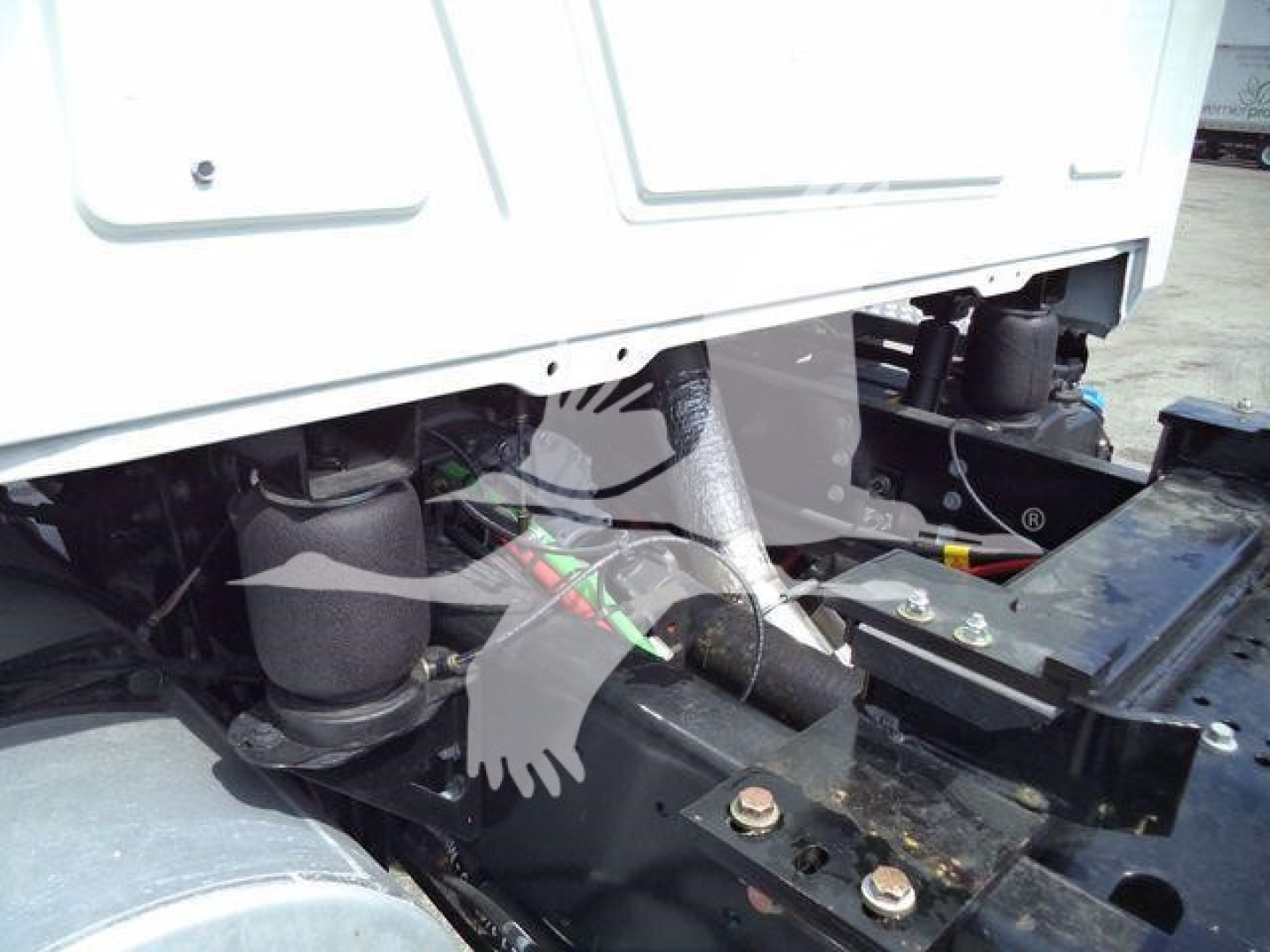 Mack MD6 truck engine bay showing front chassis and hydraulic components.