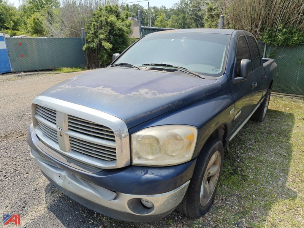 Dodge Ram 1500 Crew Cab pickup truck in blue showing front-left view with worn hood and faded paint.