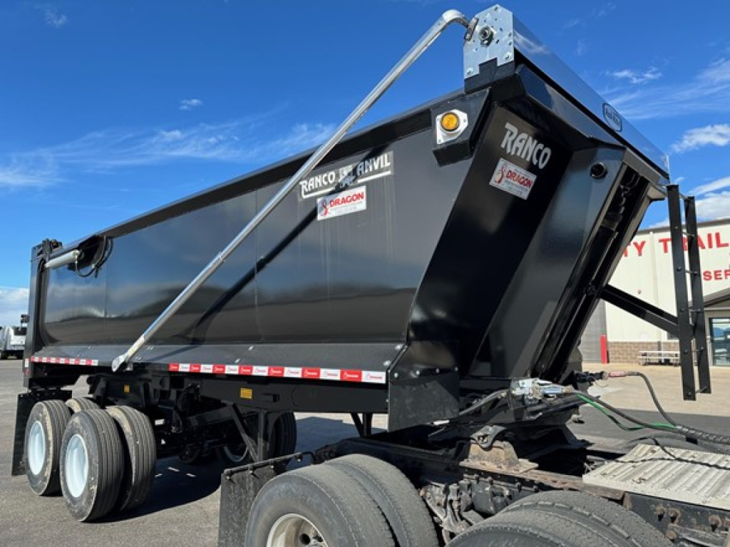 Ranco quarter frame steel end dump trailer in an in-service condition showing Ranco decals and hydraulic components.