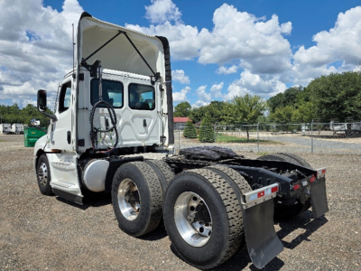 Vehicle: 2023 Freightliner Cascadia126 tractor with mid-76 wheelbase showing rear twin axles and fifth wheel. No textual labels visible on image aside from truck features.