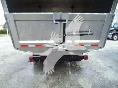 Truck rear view of a 2023 Chevrolet Silverado 6500Hd dump/box showing taillights, rear bumper, and hydraulic tilt. Stock T05573FM, chipper category, used.