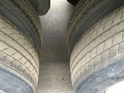 Trailer tires on a 2014 Stoughton Air Ride Dry Van trailer showing dual rear wheels and tread detail.
