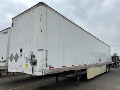 Stoughton air-ride dry van trailer in a yard showing rear and side panels with bumper, landing gear, and wheel area; visible markings include 5 3 F and reflective decals.