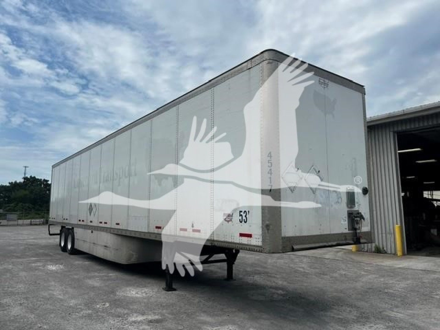 Rear and side view of a used 2017 Wabash van trailer showing tandem axles and a 53' box.