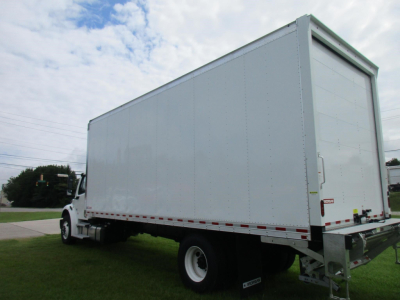 Freightliner M2 106 box truck side/rear view with tall cargo box, white exterior, chassis cab, ladder frame, and rear bumper