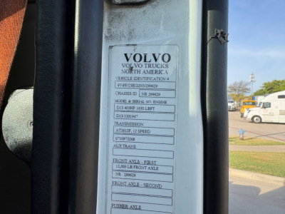 Volvo truck door jamb label showing Volvo Trucks North America vehicle identification details including chassis info, model and serial numbers, transmission, axles, and front/rear axle specs.
