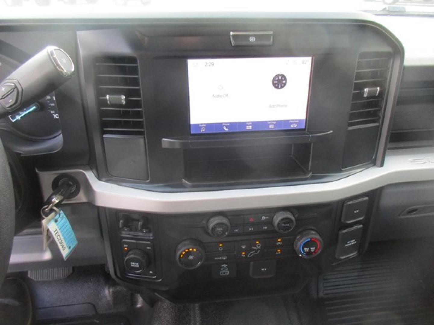 Ford F-450 dashboard and infotainment screen with center console controls.