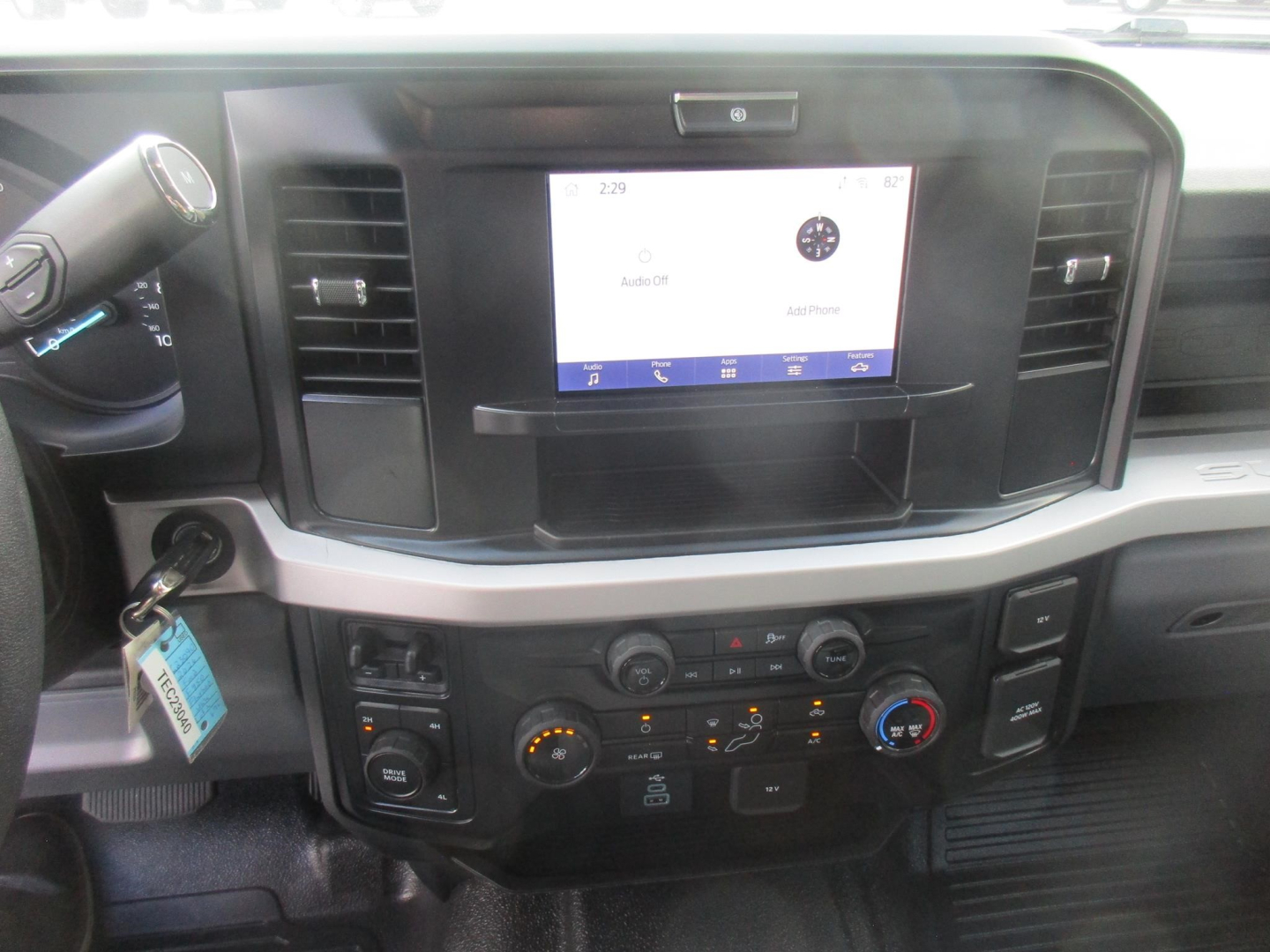 Ford F-450 interior dashboard with touchscreen display and climate controls.