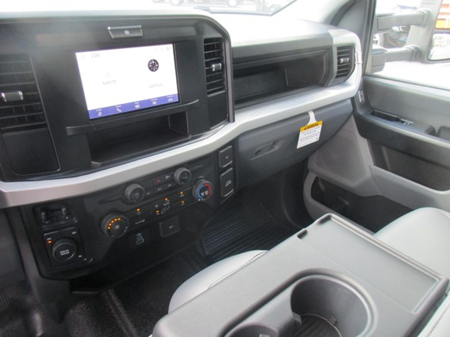 Ford F-450 interior front cabin with touchscreen infotainment display and control panel visible on dash.
