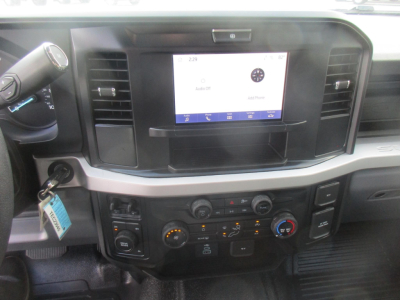 Ford F-450 interior dashboard with touchscreen display and climate controls.