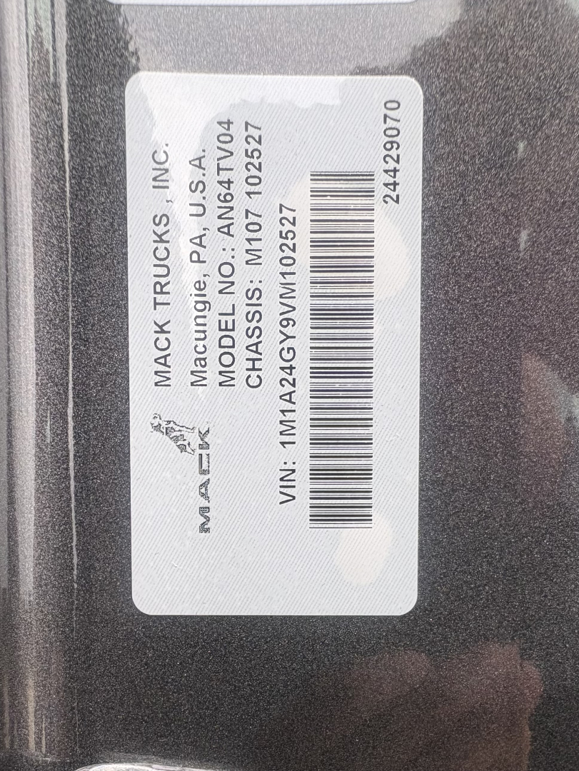 Label on Mack Trucks showing MACK TRUCKS INC, model AN64T, VIN 1M1A24GY9VM102527, MACK model PA-04 CHASSIS, stock number 72149, barcode.