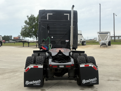 Rear view of a 2027 Mack AN64T64 truck tractor showing dual rear axles, mud flaps with Bruckner's Equipment logo, and license-area details.