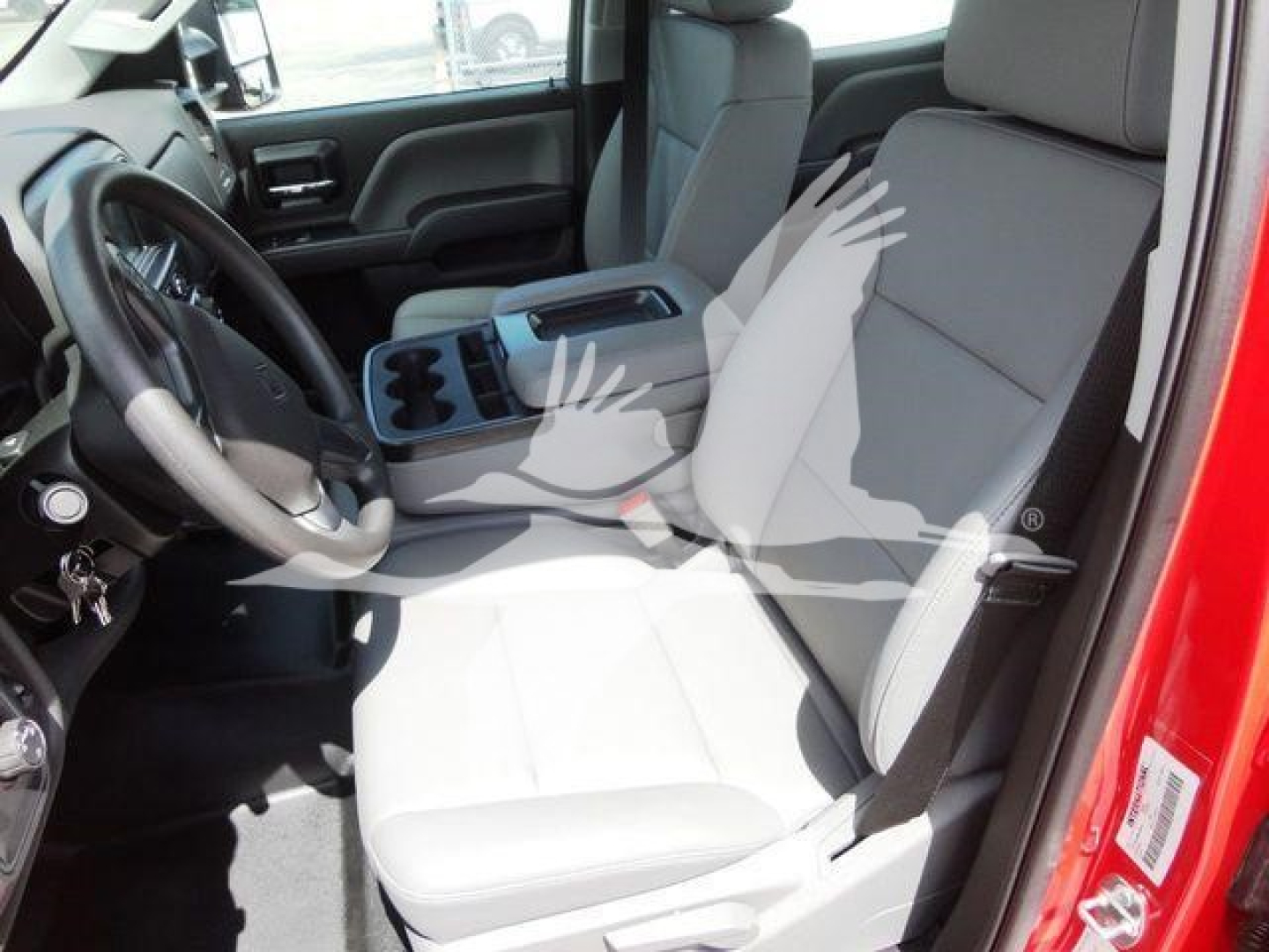 Cab interior of a 2023 International Cv rollback truck showing front seats, steering wheel, center console, and dashboard view.