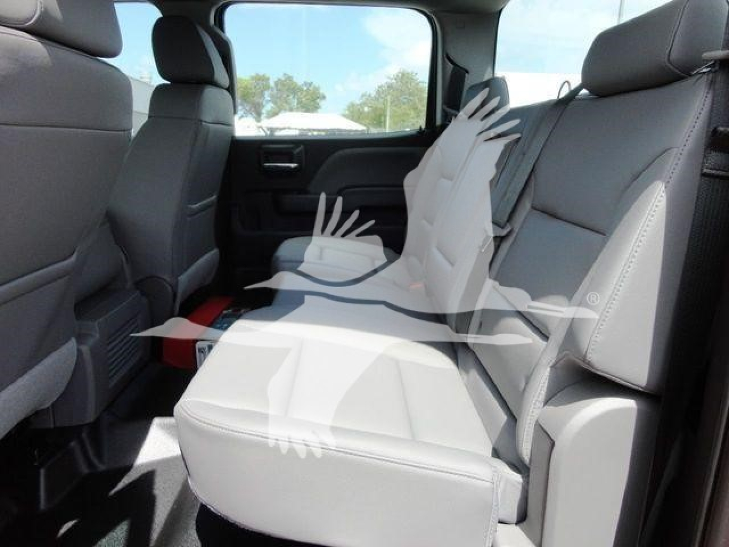 Interior of a 2023 International CV pickup showing rear seats and headrests in light gray upholstery.
