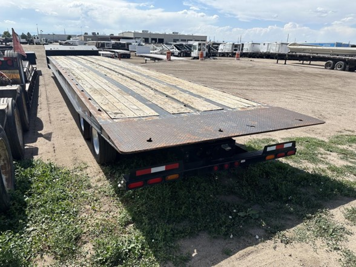 40 ton slide axle recovery trailer showing wooden deck and rear pontoons