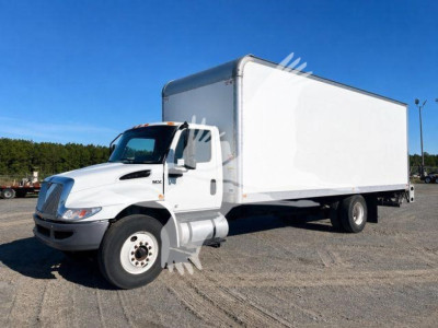 Box truck showing 2021 International MV with a white cab and large box cargo area.