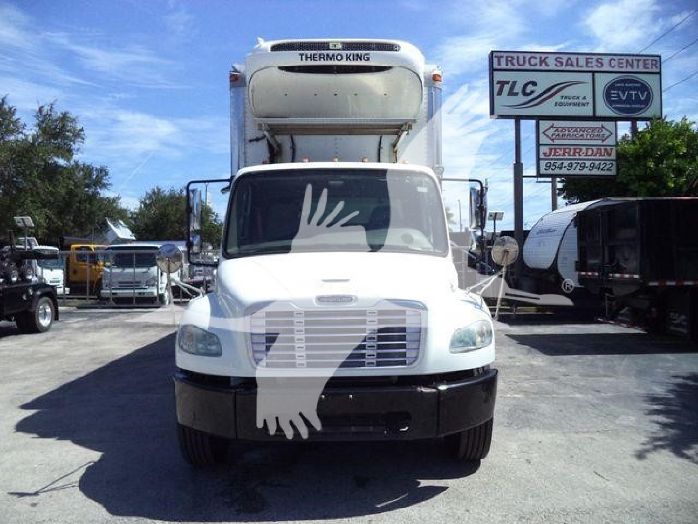 Front view of 2019 Freightliner M2 106 refrigerated truck with Thermo King unit on cab; visible signage in background.
