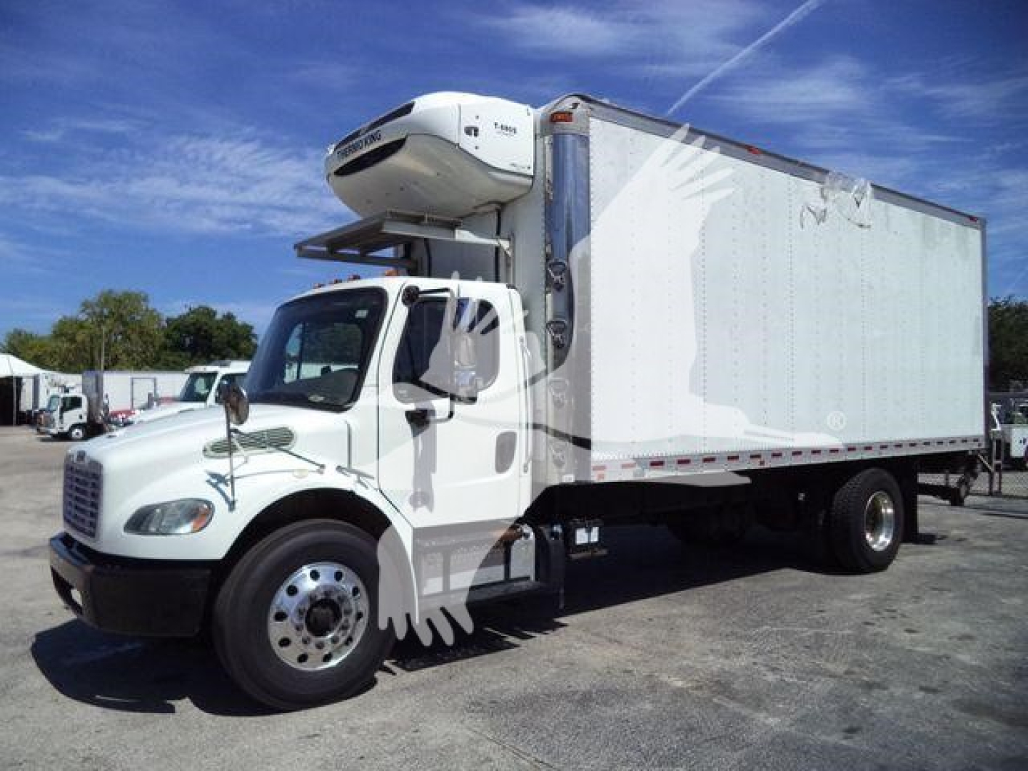 2019 Freightliner M2 106 refrigerated box truck with a front-mounted refrigeration unit on top of the cab. Side view shows large insulated cargo box.
