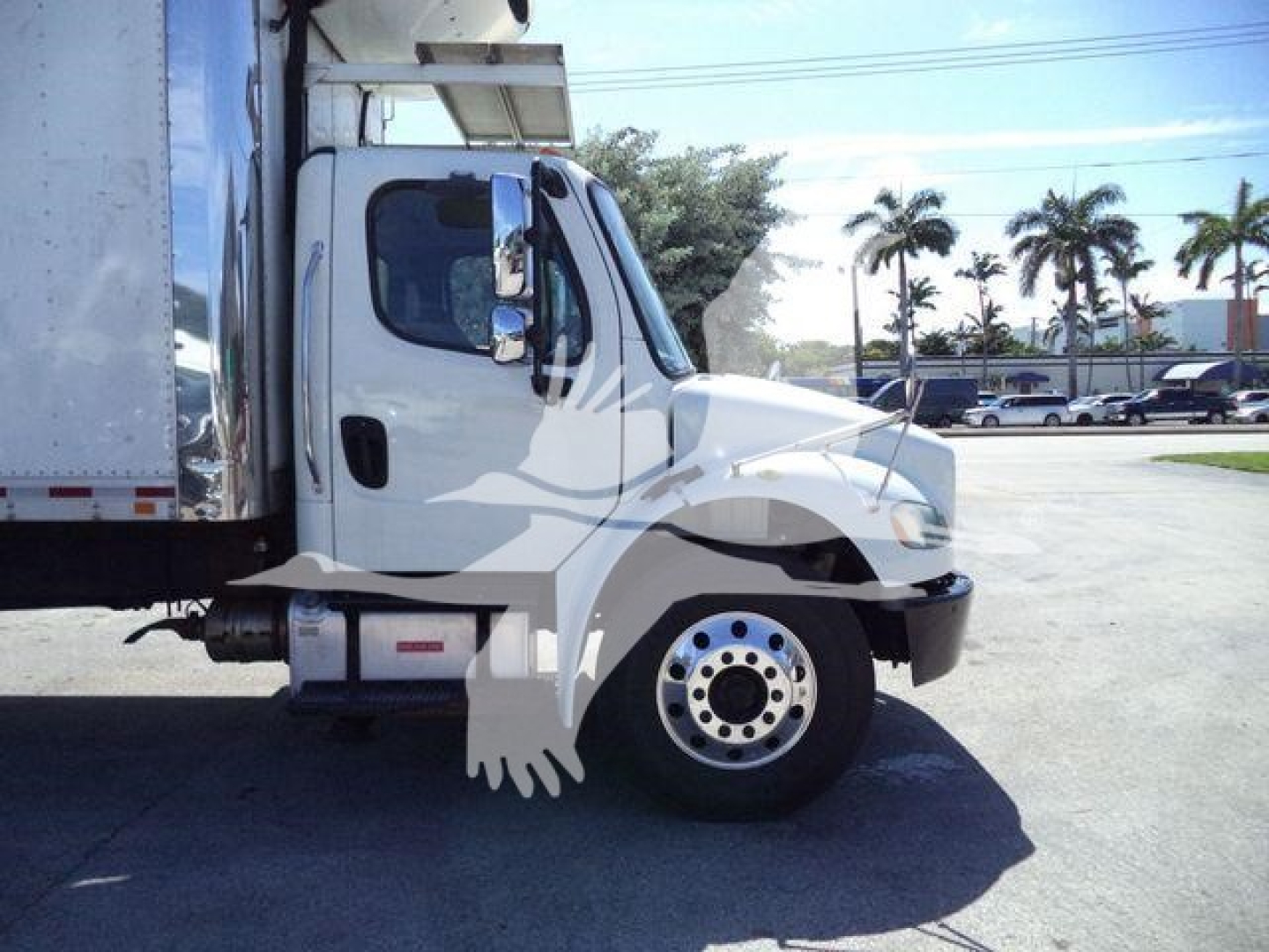 Truck cab of a 2019 Freightliner M2 106 refrigerator unit showing front wheel and door area with side mirror and cab silhouette watermark.