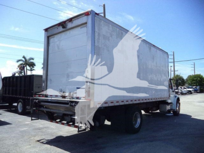2019 Freightliner M2 106 refrigerated truck rear-and-side view showing box trailer with plain aluminum panels and rear roll-up door.
