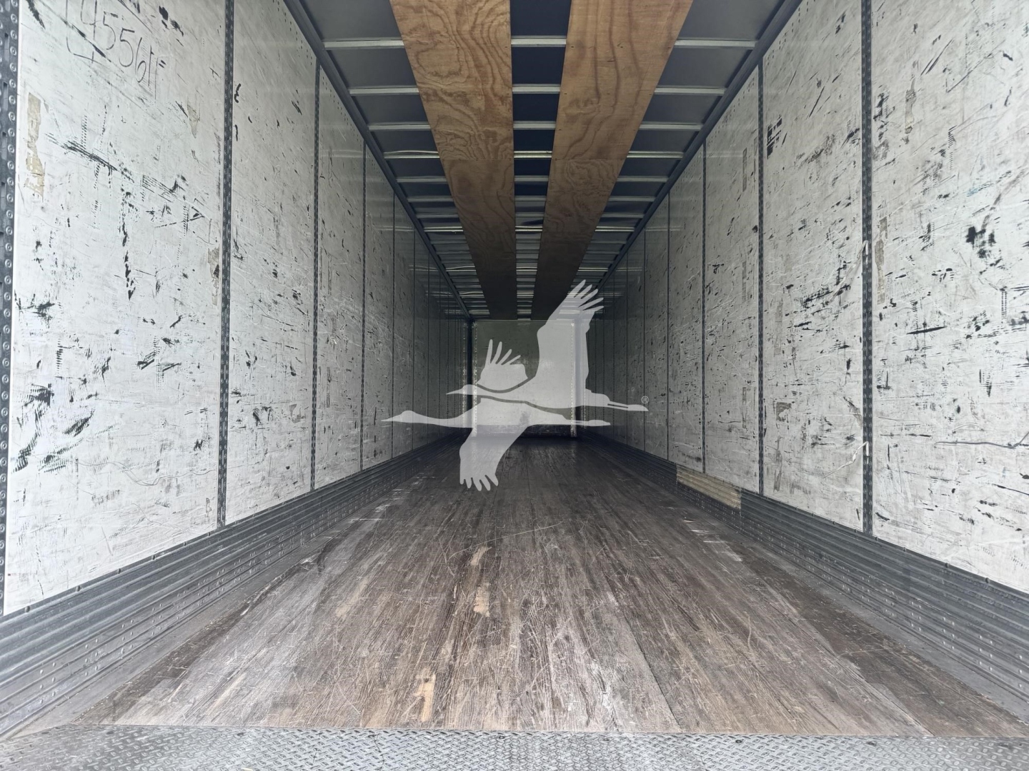 Trailer interior showing wooden floor and side walls with overhead rails, empty cargo space in a 2017 Wabash dry van.