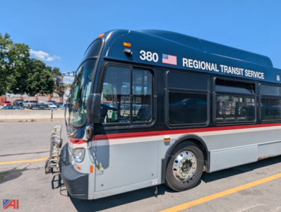 Bus side view showing 380 Regional Transit Service branding on dark blue upper body and light gray lower body, XD60 New Flyer transit bus, 2013 model era signage