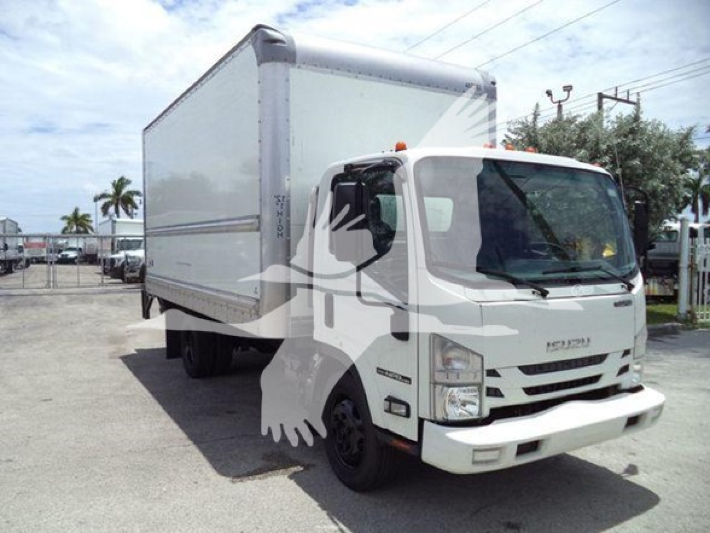 Isuzu NPR HD box truck showing white cab and large cargo box side view