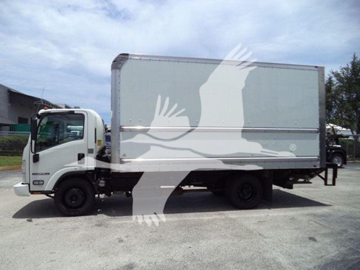 Isuzu NPR HD box truck side view showing cab and large rear cargo box.
