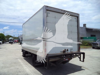 Isuzu NPR HD box truck rear view showing cargo box and rear bumper.