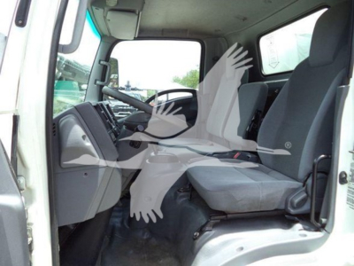 Isuzu NPR HD truck interior showing driver seat and passenger seat with dashboard and steering wheel.