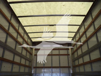 Isuzu NPR-HD truck cargo area showing empty box interior with side rails and overhead beams.