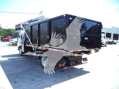 Isuzu NRR roll-off truck bed with black dumpster-style container mounted on chassis, rear view showing tail lights and bumper.