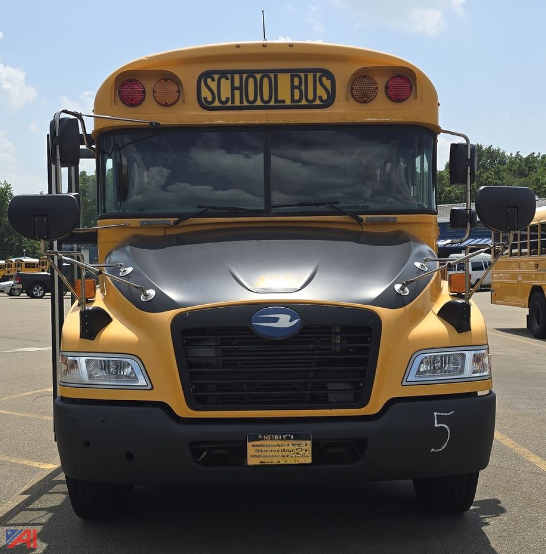 School bus front view with yellow body and gray hood showing 'SCHOOL BUS' sign and large windshield.