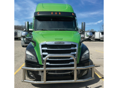 Front view of a green 2021 Freightliner Cascadia 126 sleeper truck with a metal grille guard.