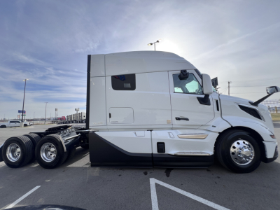 Volvo VNL64T840 sleeper cab tractor profile showing side text and wheel configuration.