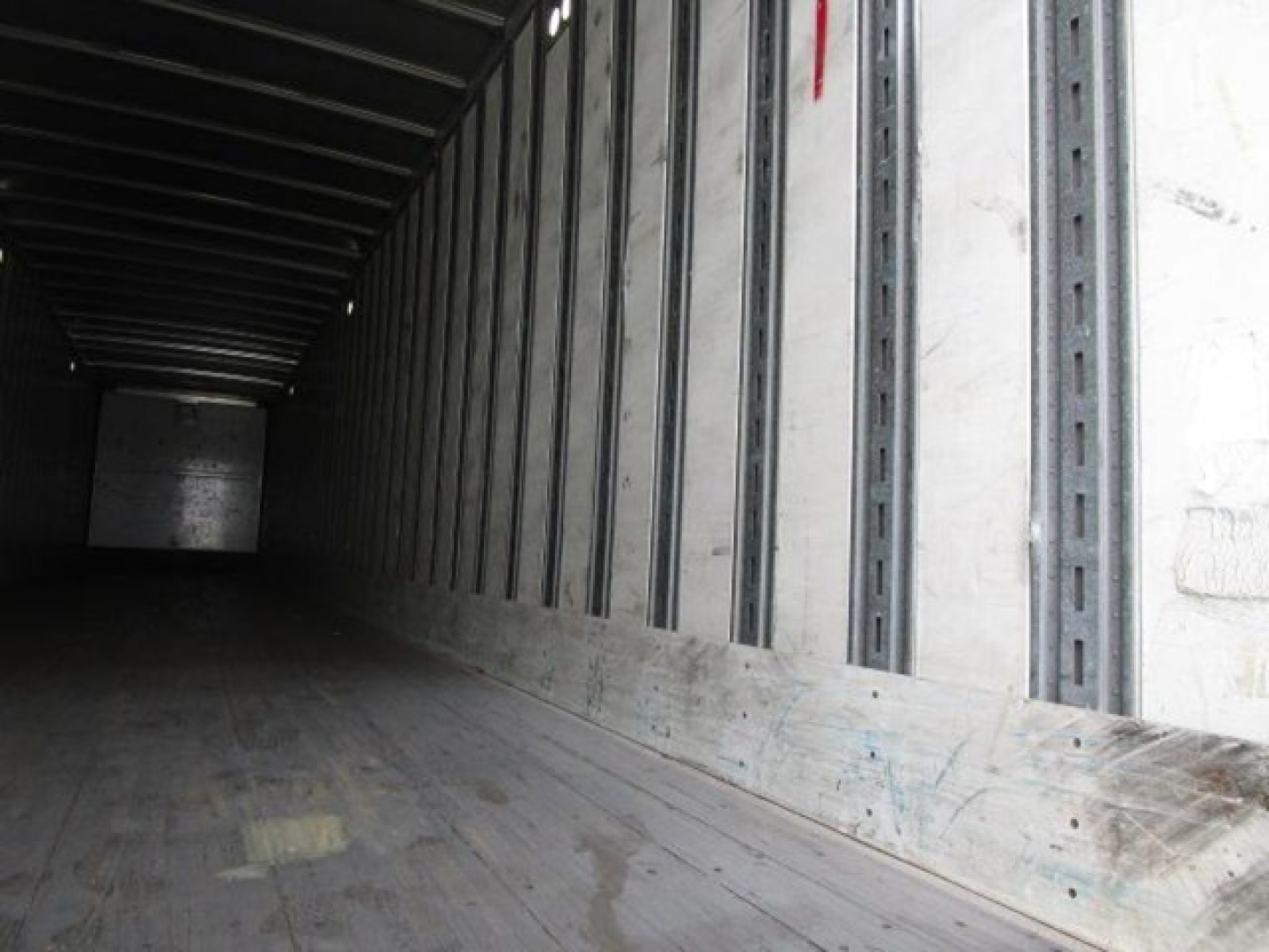 Stoughton van interior trailer with wooden floor and metal side walls showing cargo area.