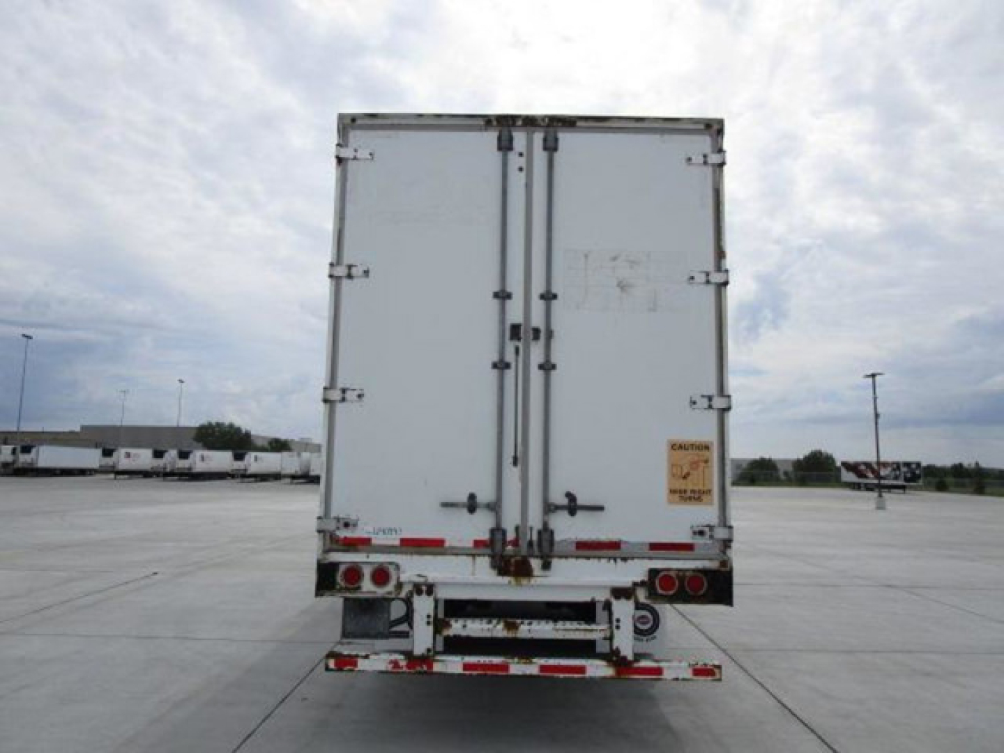 Stoughton van trailer rear view showing double rear doors and taillights.