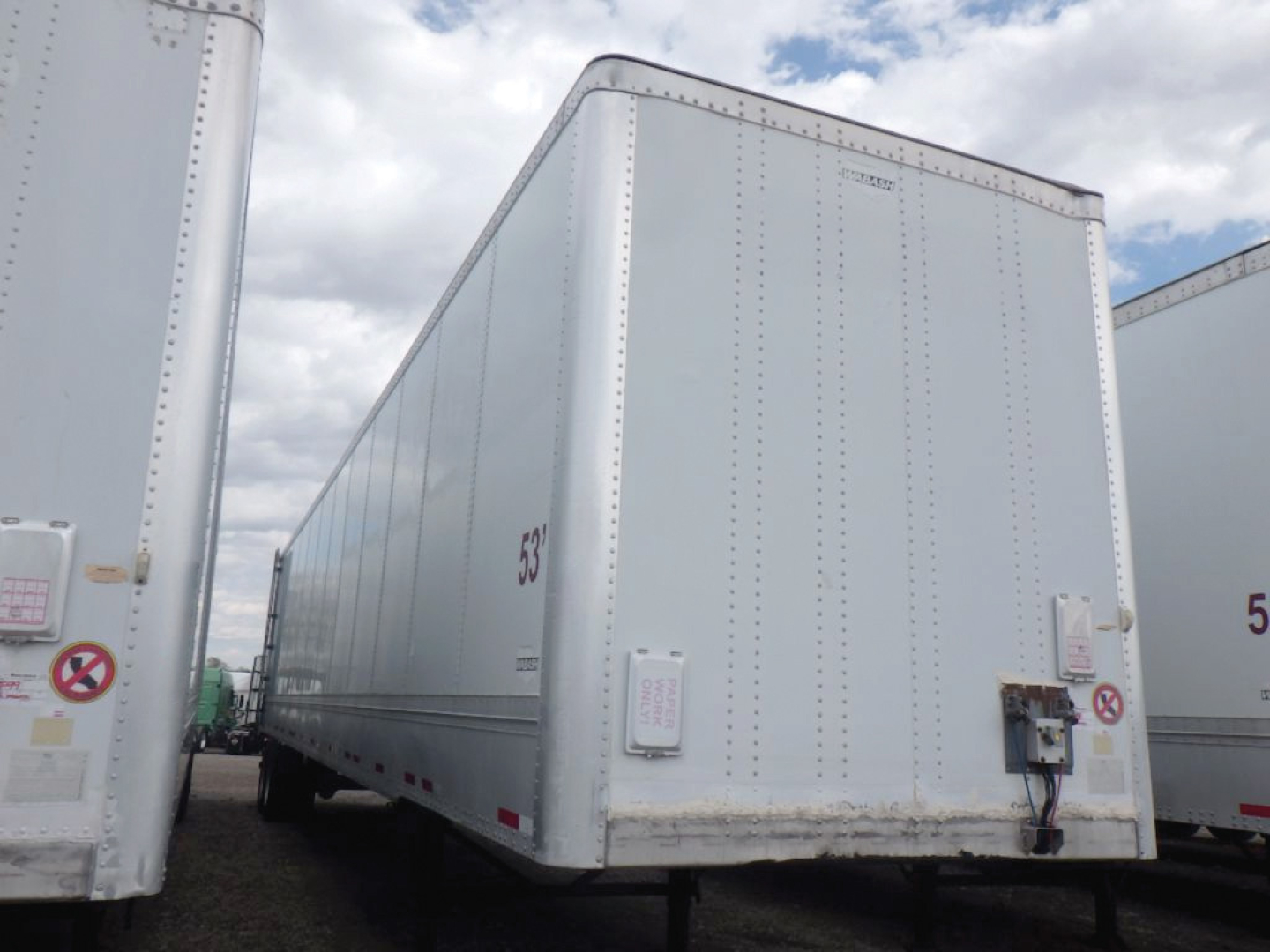 Wabash DuraPlate HD van trailer showing front and side, white with riveted panels and rear electrical box