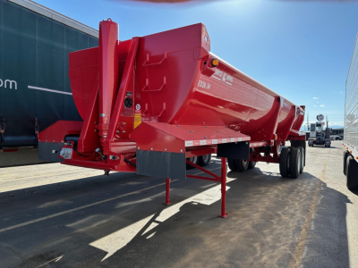 Ranco ED26-34 dump trailer in red, side view, showing hydraulic hoist and landing legs. Visible text on side includes ED26-34 and some serial/brand decals; VIN and stock numbers are in listing, not on the image.