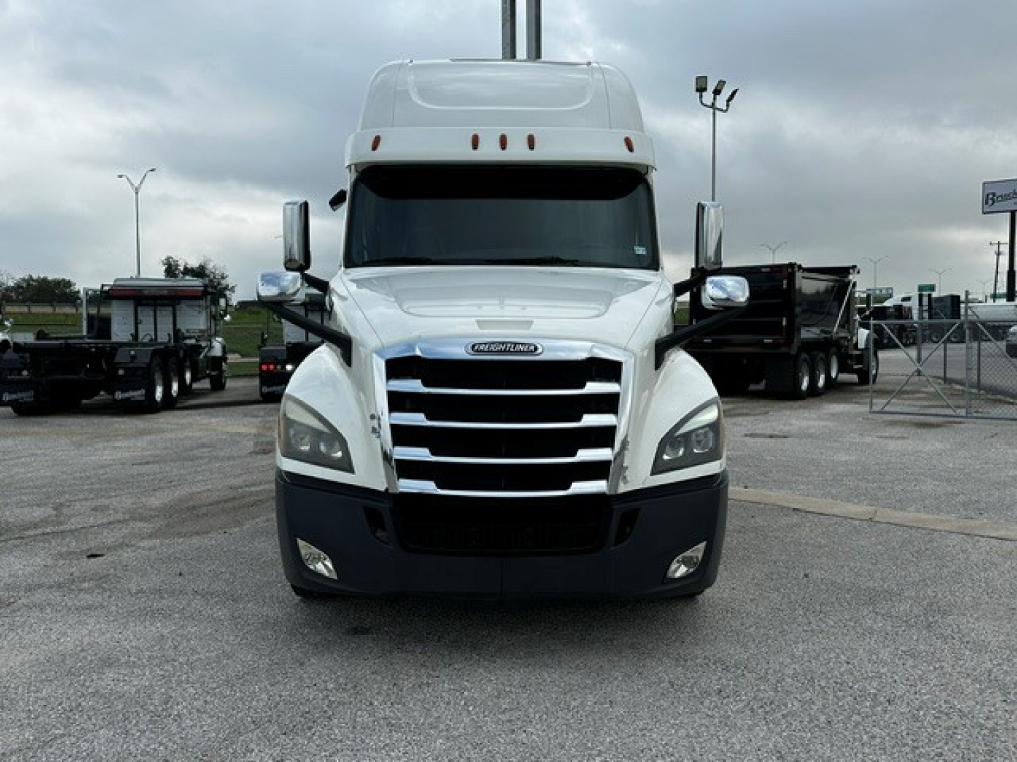 Freightliner Cascadia 126 front view showing chrome grille, headlights, and bumper. No visible text beyond truck branding on grille.